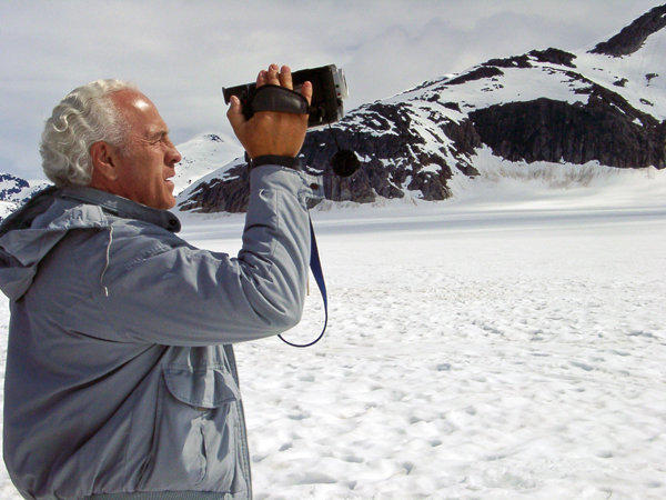 Lee Duquette filming the massive glacier